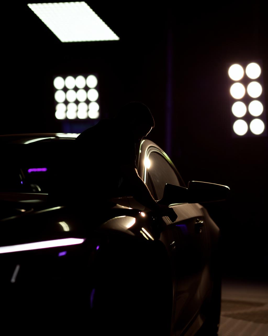 Detailer at work under studio lights